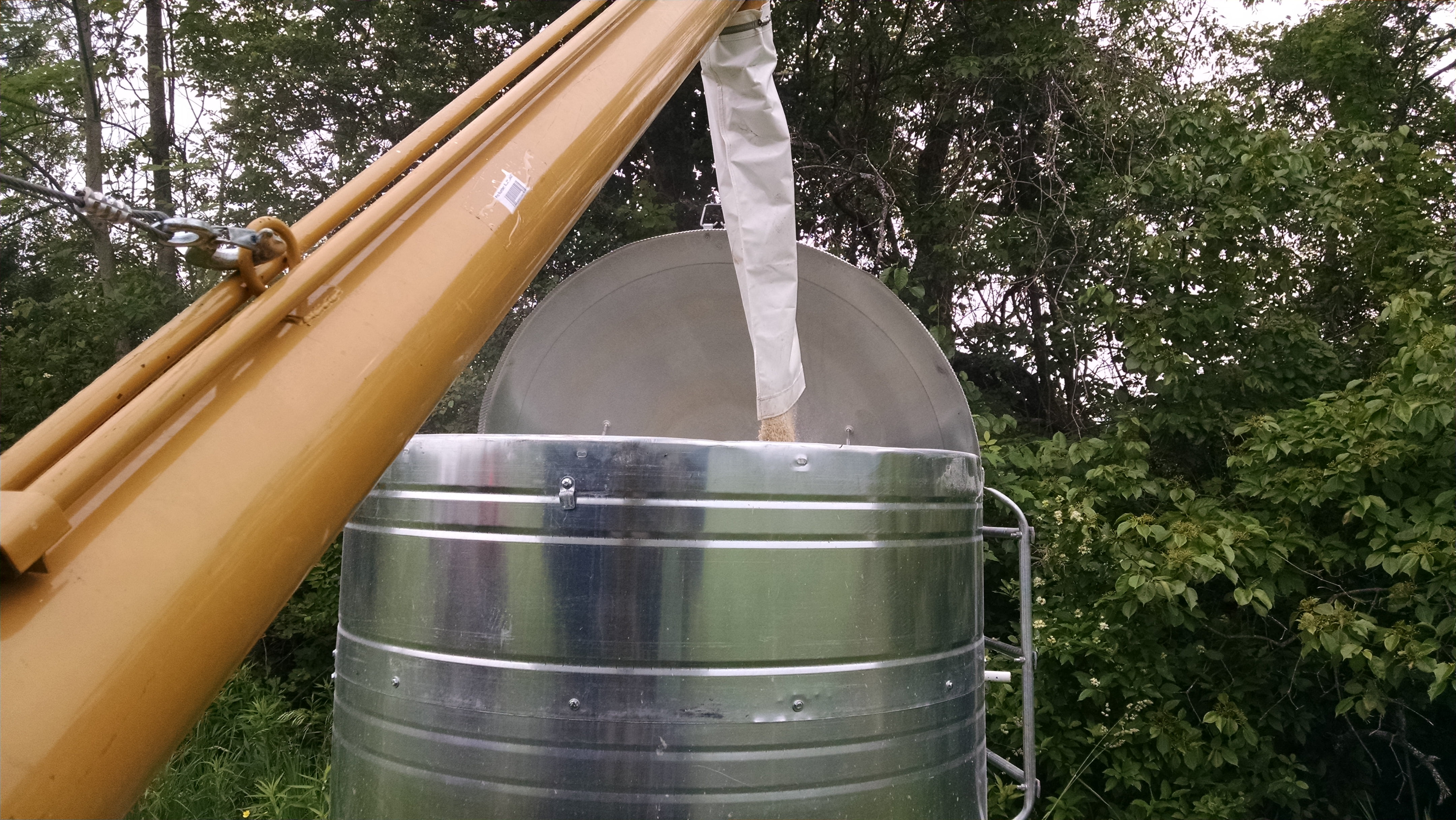 Sure beats shoveling grain into barrels, moving the barrels, then shoveling it back out into the feeder.