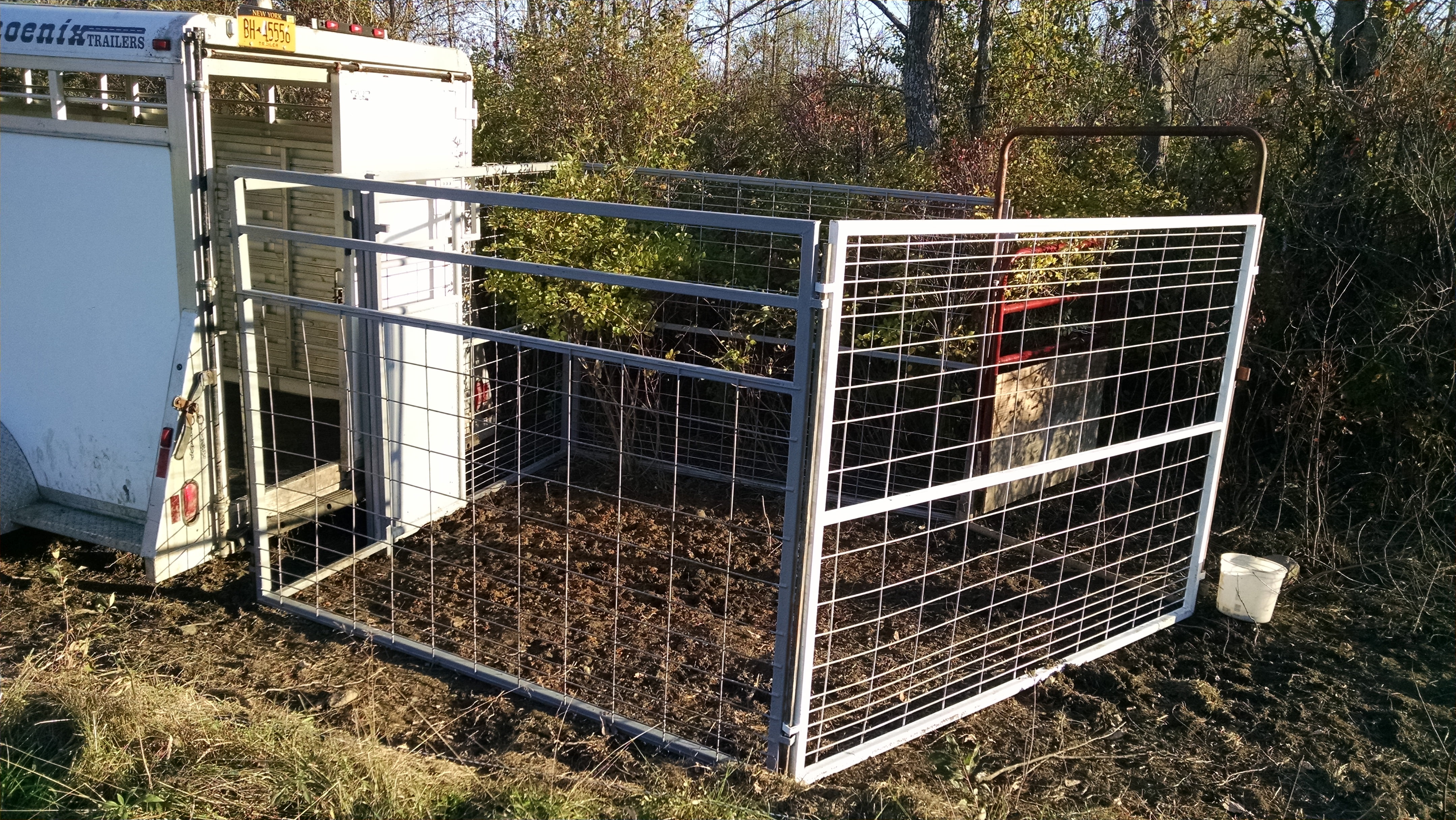 The trial configuration worked beautifully.  The gate panel doesn't have mating pins, so that's the only component that requires extra work to wire it into place.  About three more corral panels should suffice to make this a little more practical.