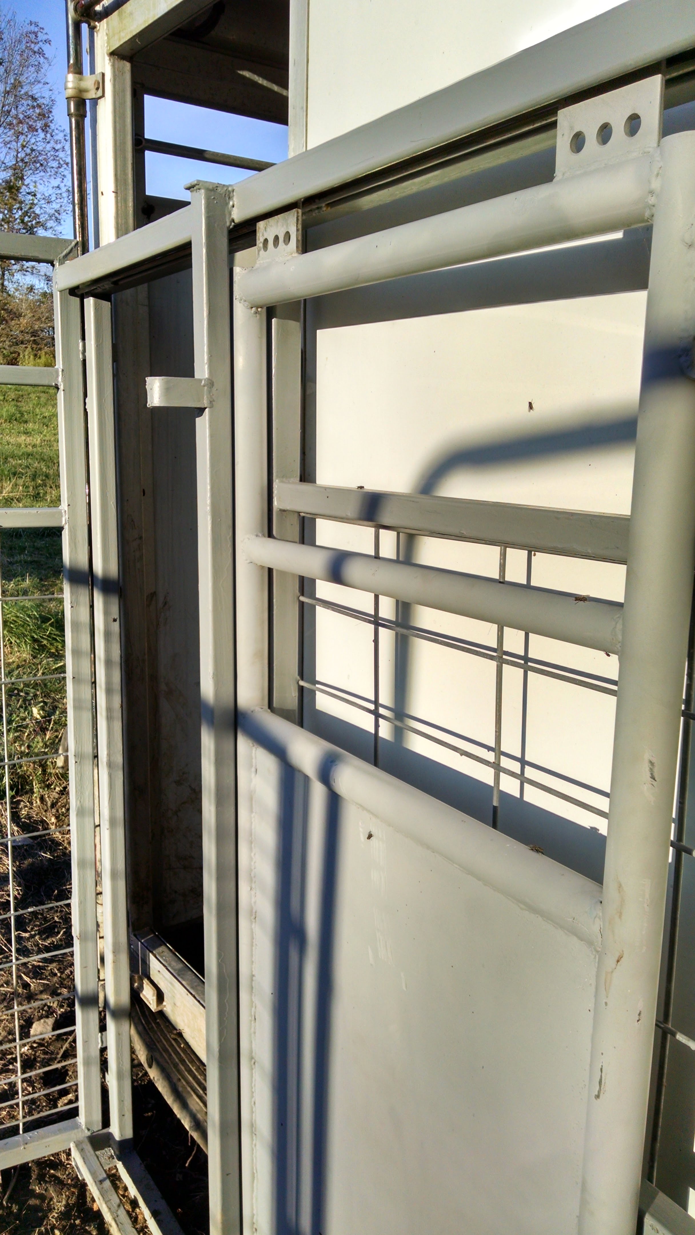 I built a slide gate into one panel.  In this configuration it is redundant with the slider on the back of the trailer, but I wanted to make a provision for different configurations where the corral would lead into a chute or another pen.