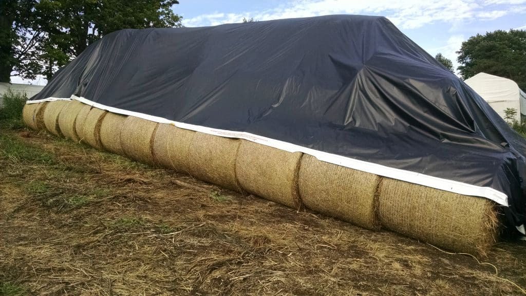 Tarping Round Bales – Wrong Direction Farm