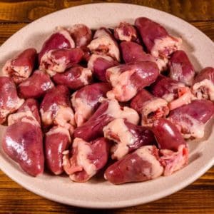 Pasture raised and Certified Organic Chicken Hearts from Wrong Direction Farm on a ceramic plate.