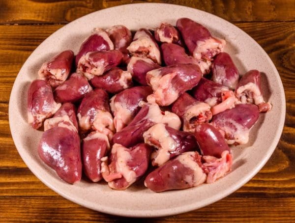 Pasture raised and Certified Organic Chicken Hearts from Wrong Direction Farm on a ceramic plate.