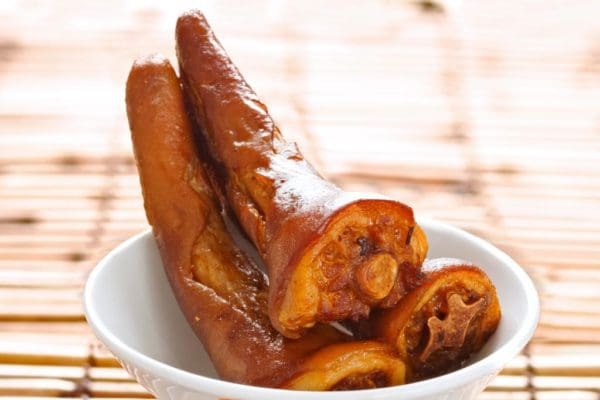 Fried pasture raised pork tails in bowl.