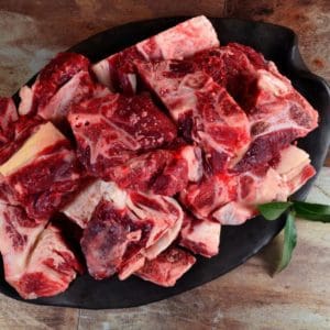 A plate of meaty grass fed beef neck bones from Wrong Direction Farm.