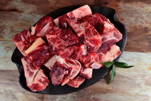 A plate of meaty grass fed beef neck bones from Wrong Direction Farm.